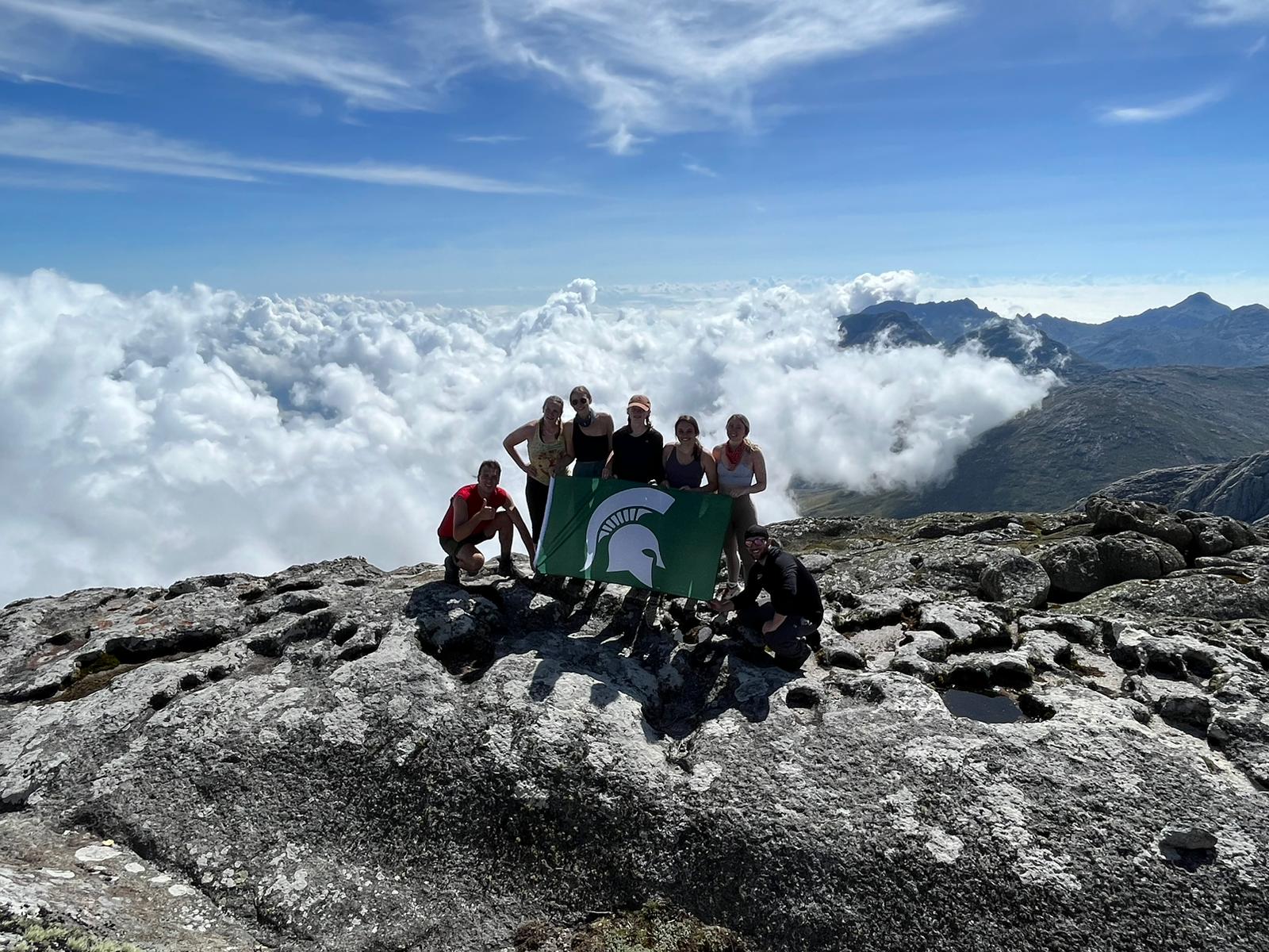 Students sitting on a mountain top in Malawi